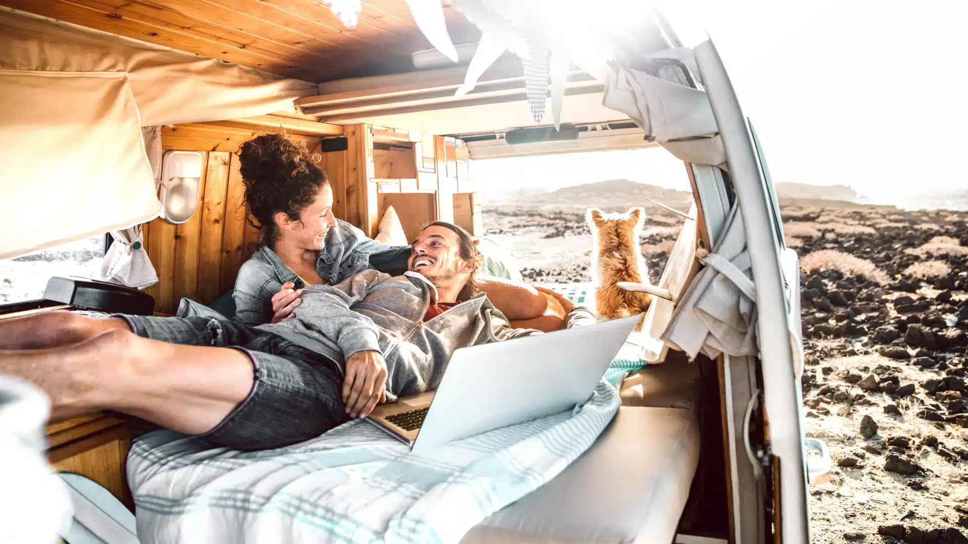 People in a van on a laptop looking for wifi