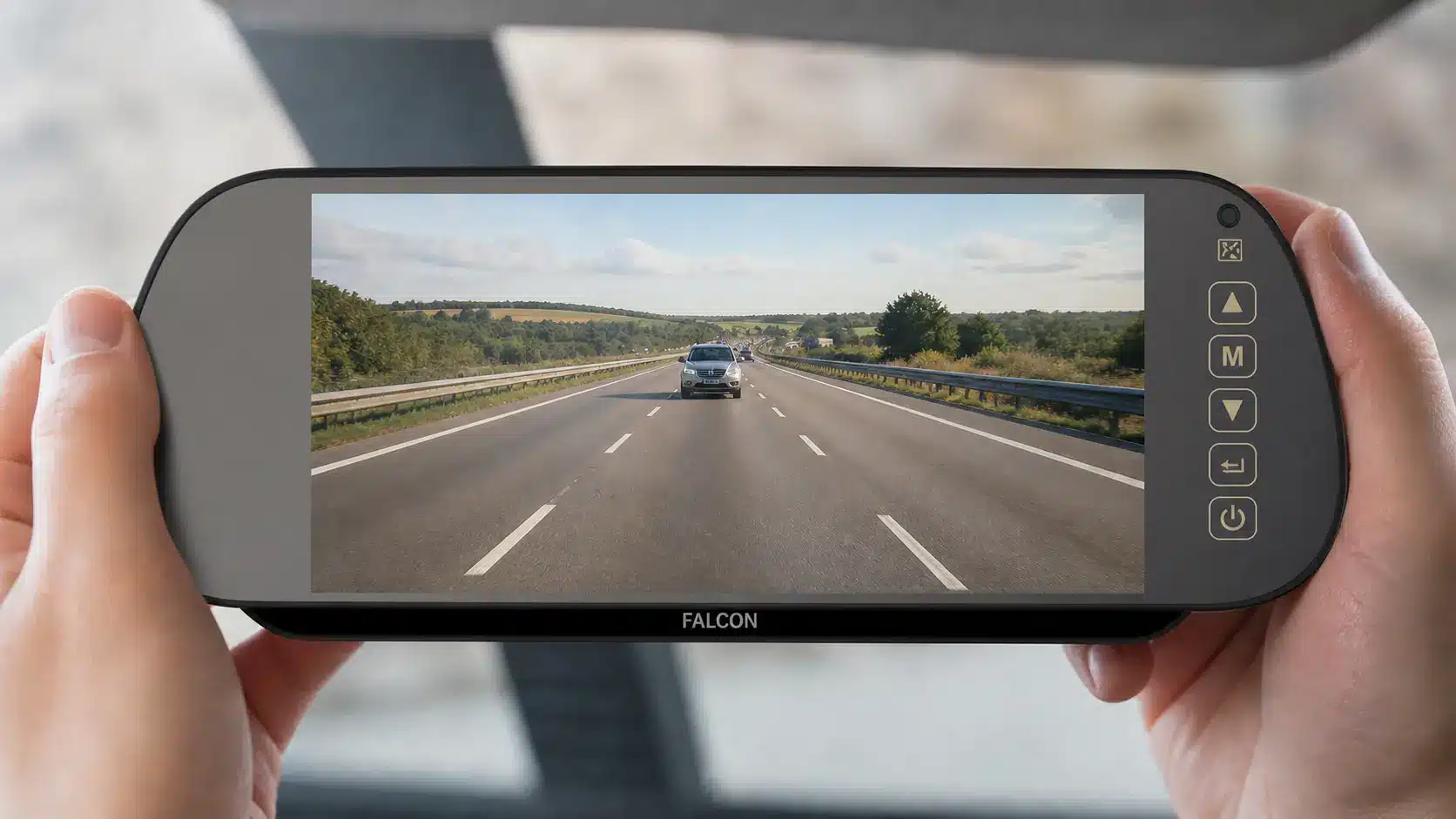 Falcon rear-view monitor showing a live motorway view of the road behind while towing.